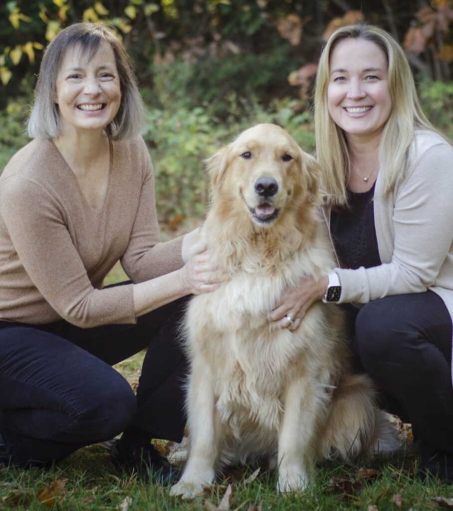 Ann Stanton and Hilary Hayner, owners of Seacoast Hand Therapy, with Finn, a Golden Retriever.