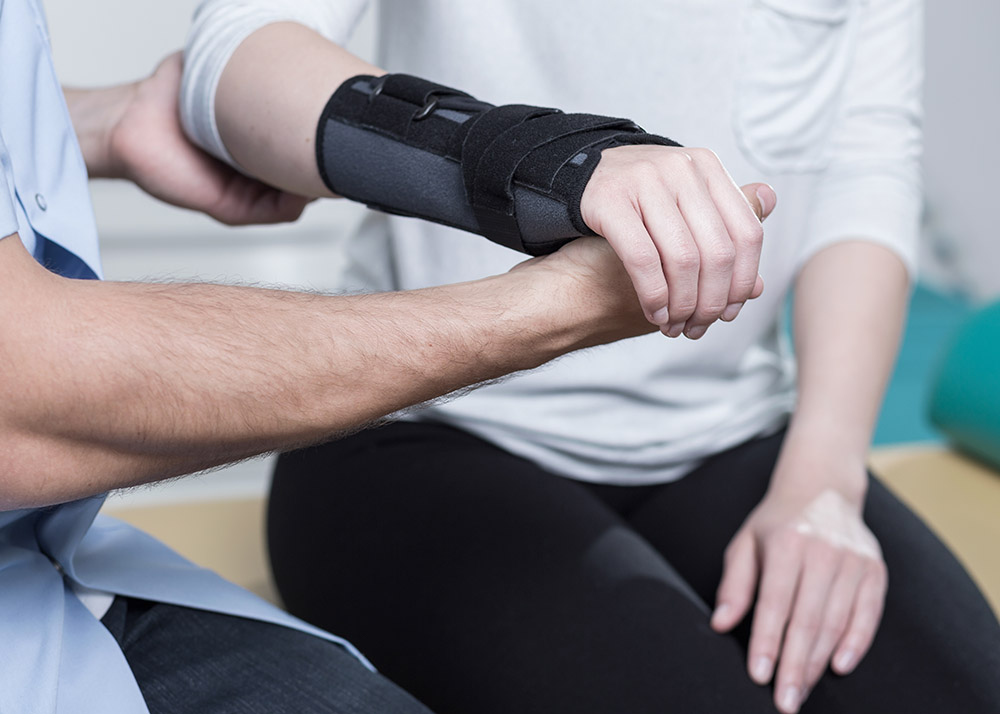 Hand in brace during physical therapy treatments.